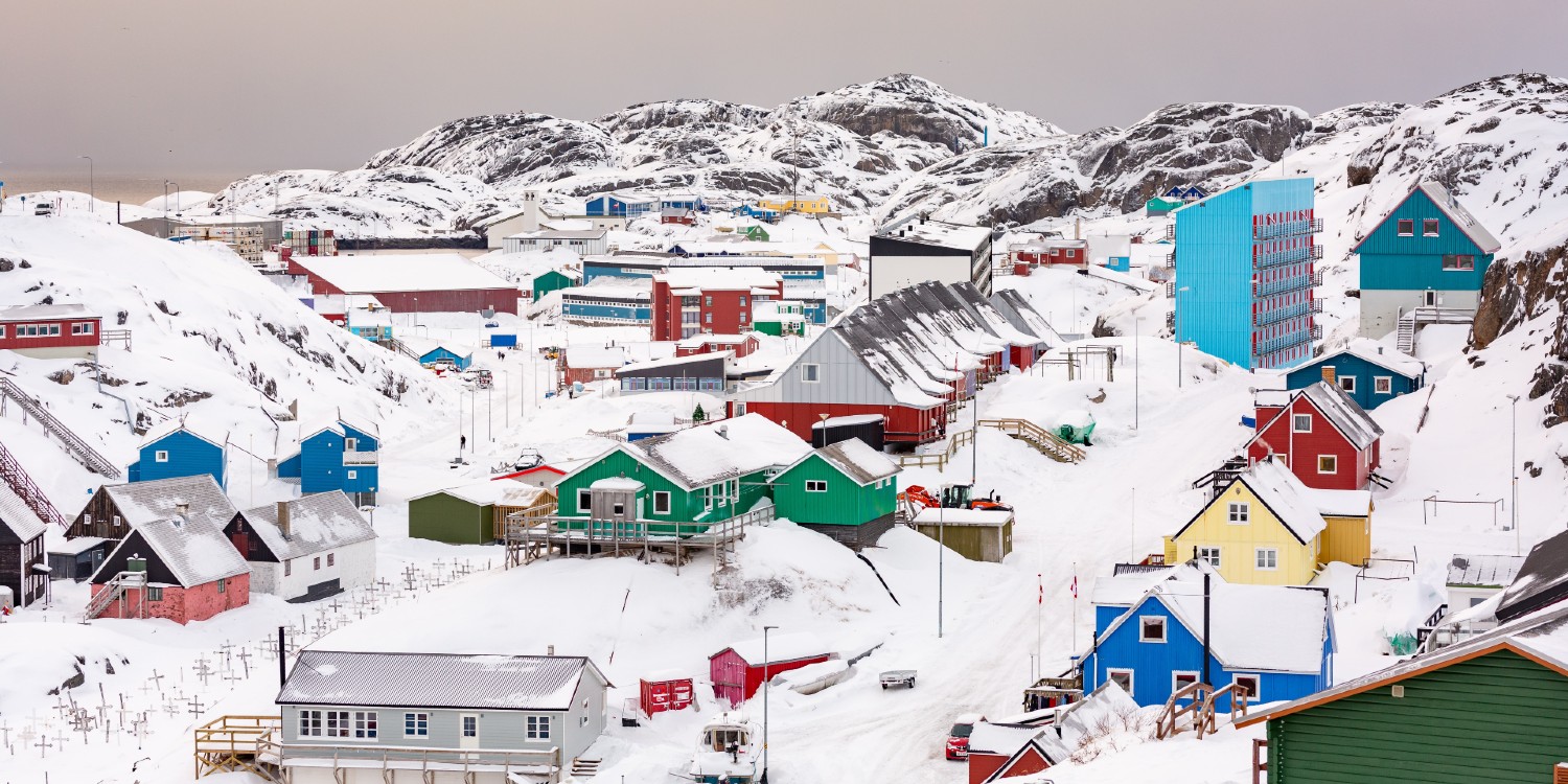 colourful Greenland houses covered in snow 