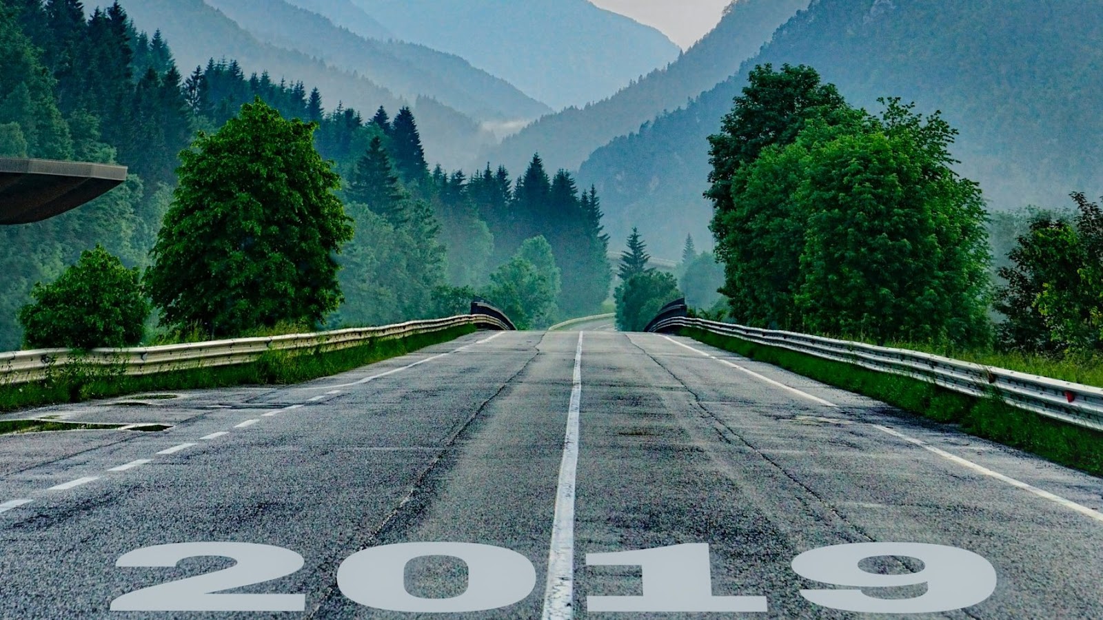 Open highway with "2019" at the bottom of the road