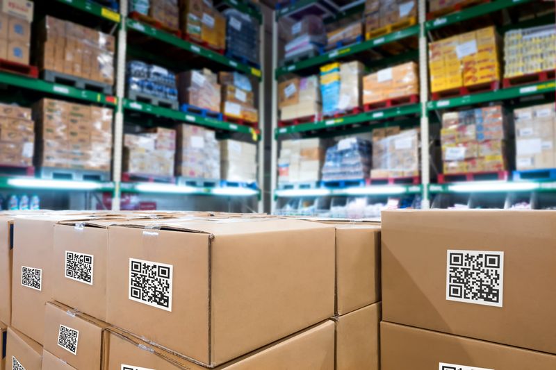 accounting bookkeeping services - closeup of warehouse inventory boxes with qr codes