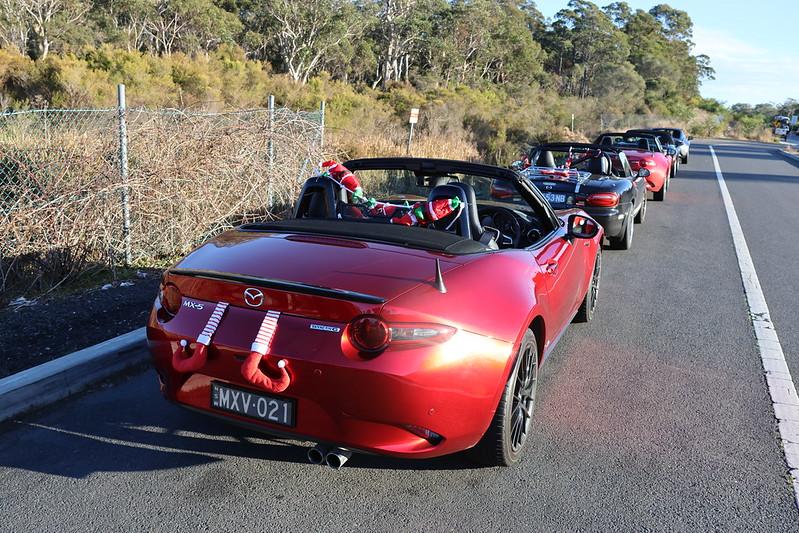 A group of cars on a road

Description automatically generated