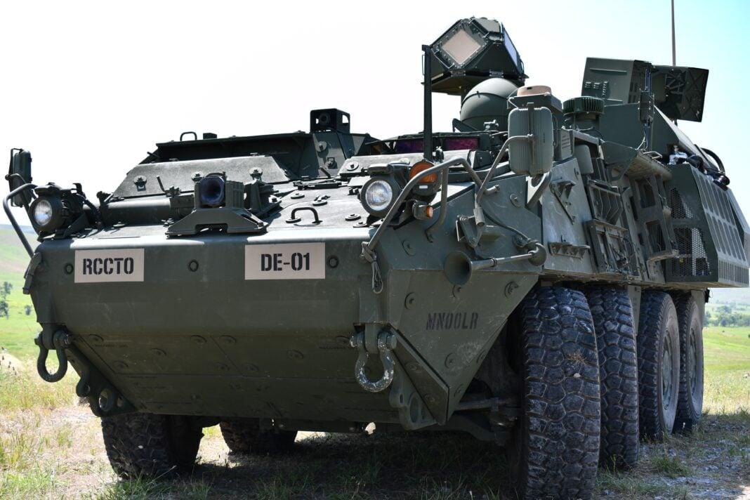 A picture containing military vehicle, grass, outdoor, sky

Description automatically generated