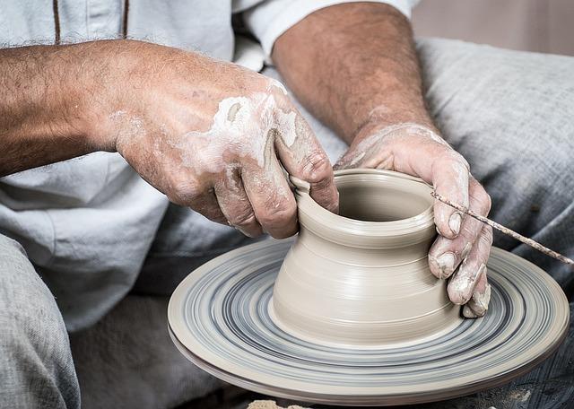 Etsy: hands making a clay vase