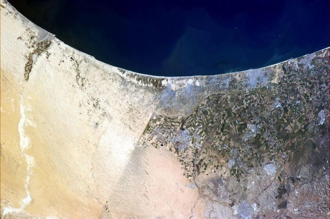 16) Egypt and Israel - Canadian astronaut, Commander Chris Hadfield, took this amazing photo from the International Space Station. It shows Egypt on the left, Israel on the right, and the self-governed entity of The Gaza Strip stretched out along the Mediterranean Sea.