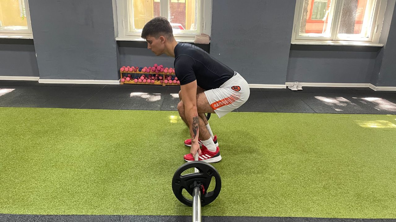 Vanja performs a barbell deadlift.