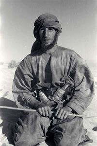 Vintage Arab man holding stick in a hand.