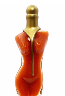 A glass bottle of hot sauce in the shape of a woman's body