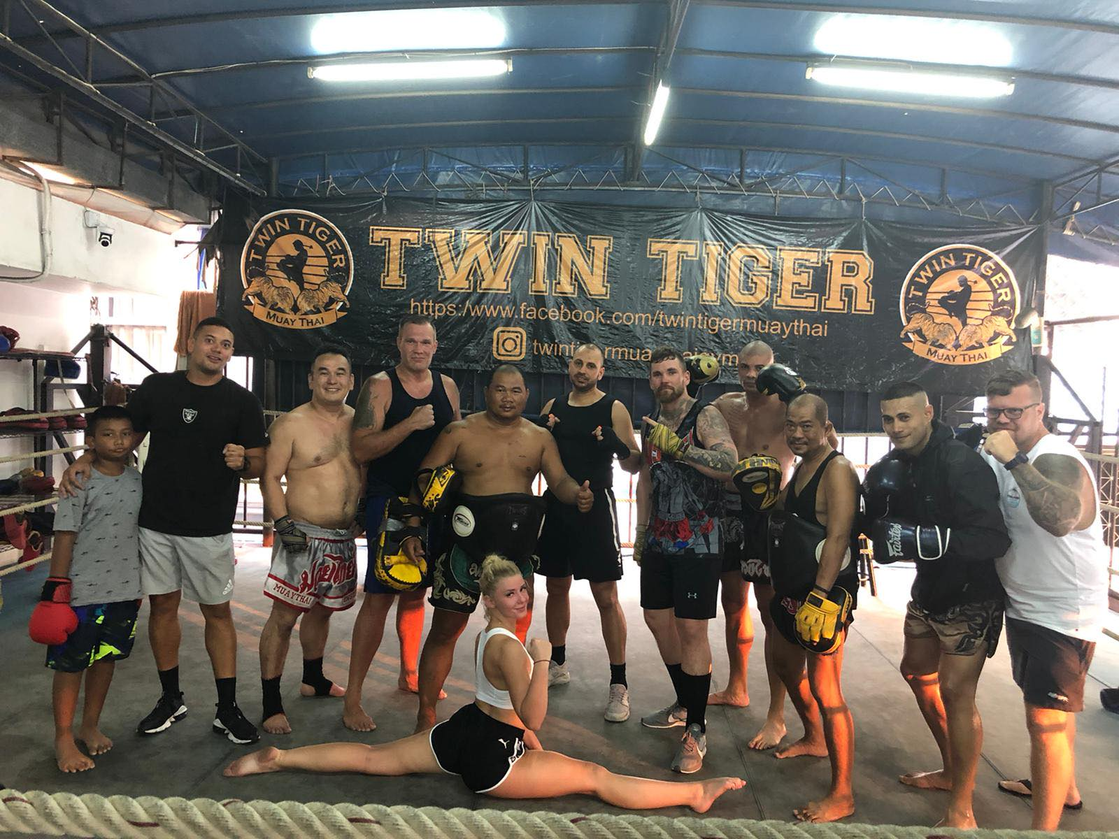 Participants pose at a Muay Thai camp.