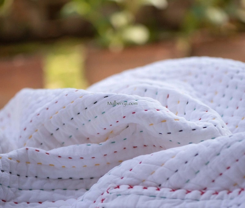 White kantha quilt from Etsy seller MulberryLoom