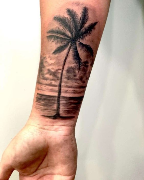  A beautiful design of the palm tree tattoo design on the beach