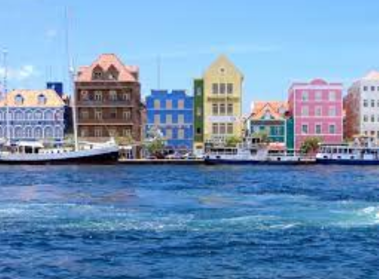 colorful houses in Willemstad with the sea on the backdrop