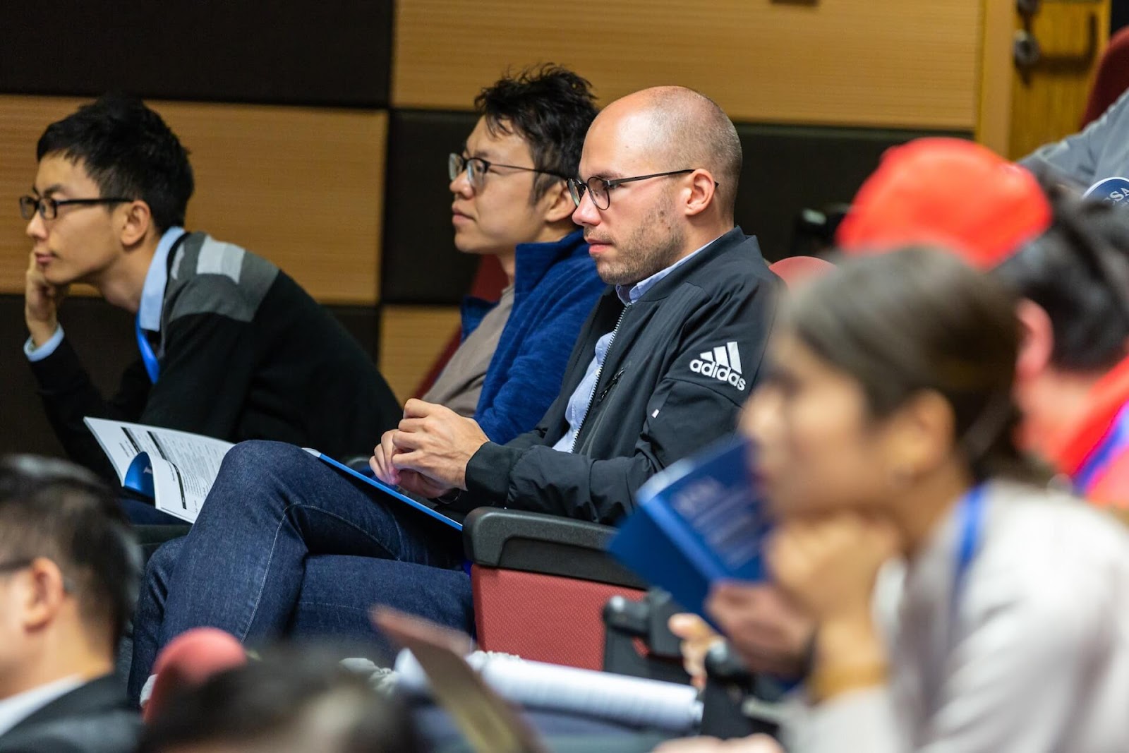 Graduate students sitting in a classroom during a lecture