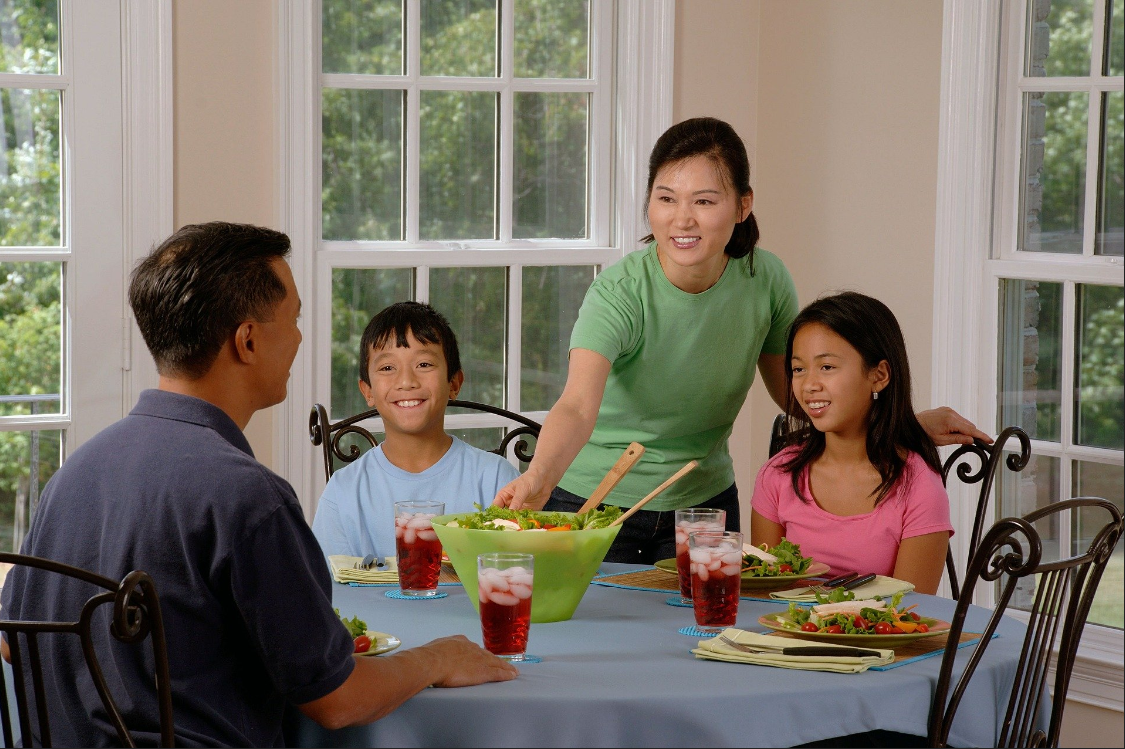 Family sitting down to eat