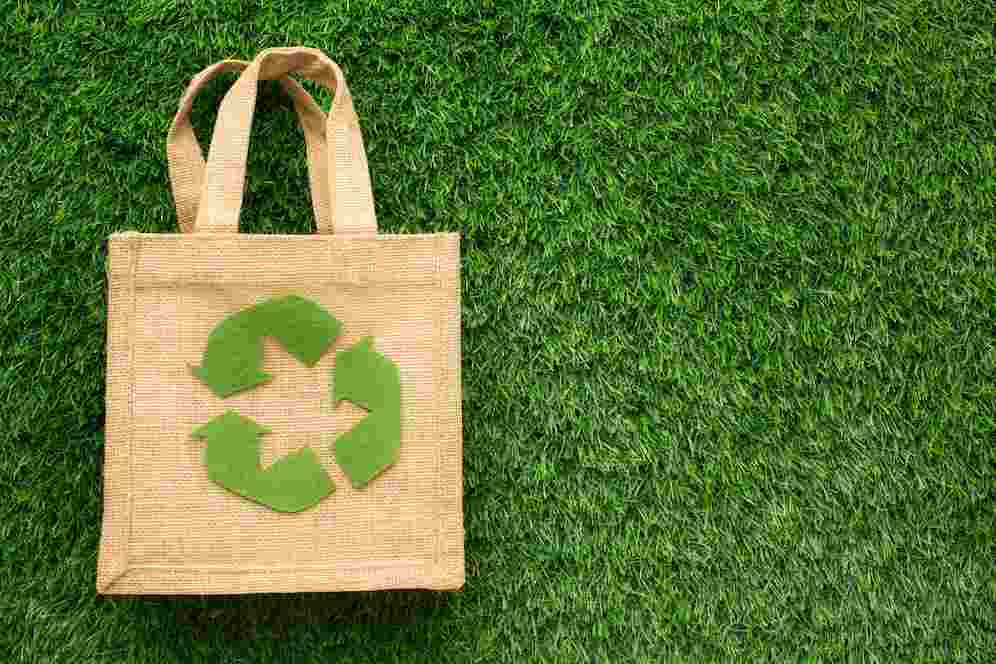 A reusable bag on green grass. Image source: Freepik licensed under CC BY-SA 2.0 