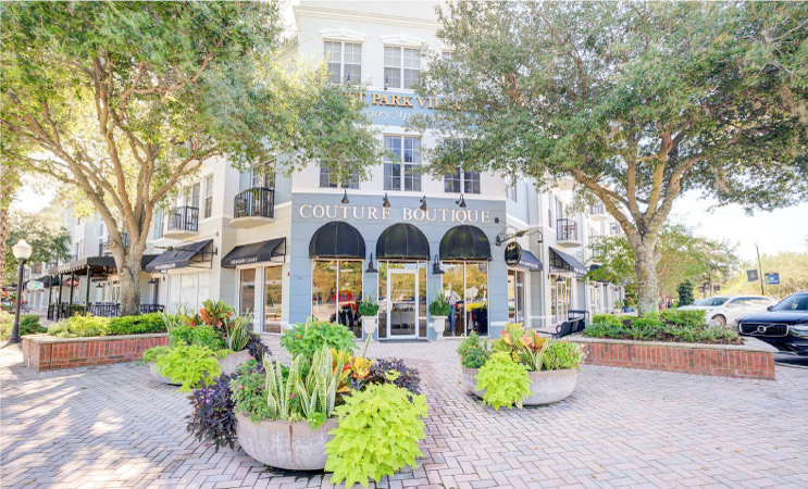 Couture Boutique and other retail shops in the West Park Village Apartments residential and shopping district. West Park Village is located in the Westchase neighborhood of Tampa, Florida.