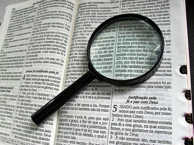 magnifying glass placed on the bible