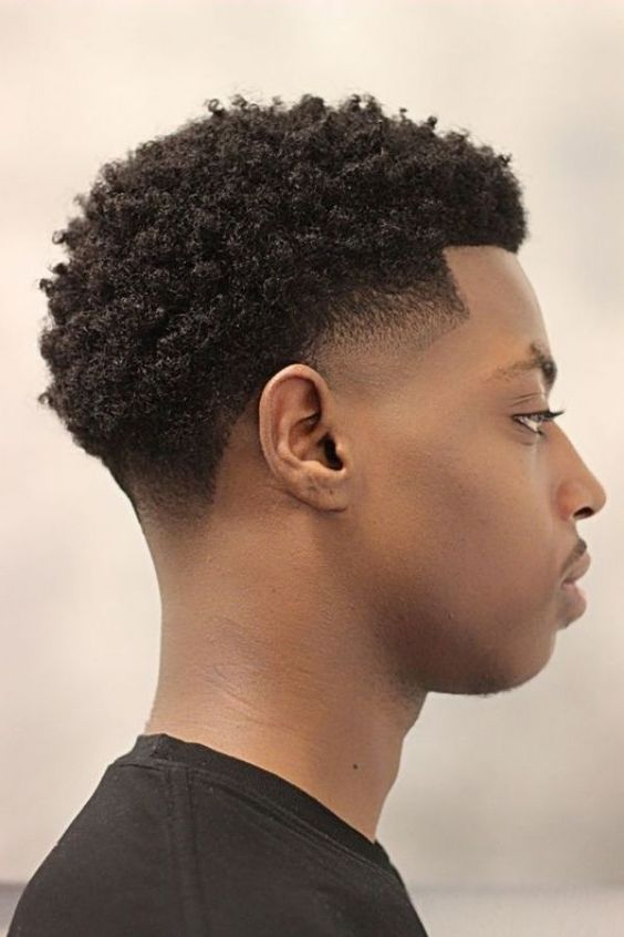 Side view of a black guy rocking the stylish haircut