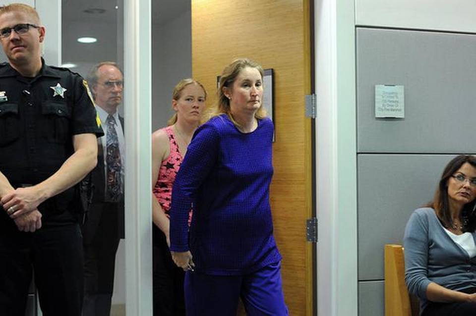 Alan and Sheree Napier and one of their daughters arrive at the courtroom Wednesday. The jury announced its guilty verdict on multiple counts of aggravated animal abuse.