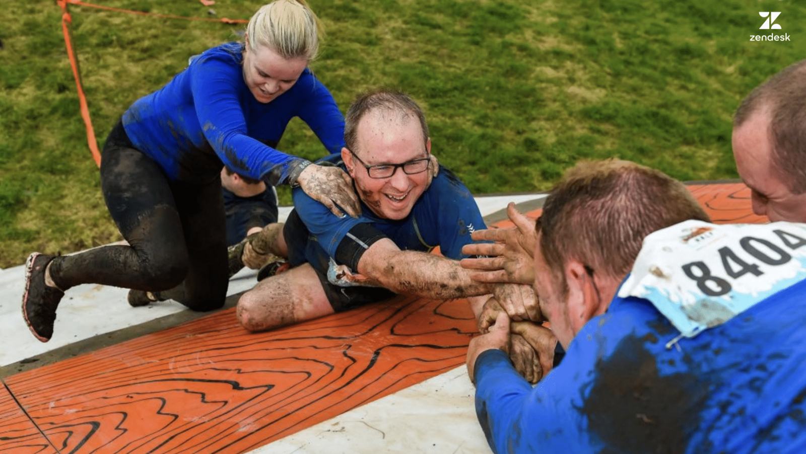 People working together on assault course