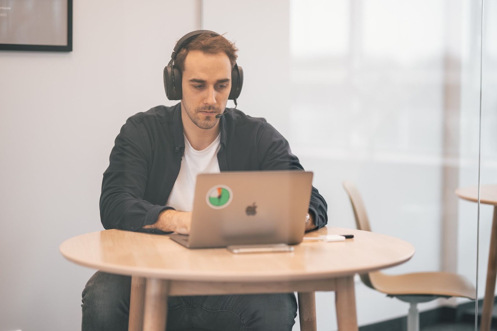 Employee wearing headphones while working