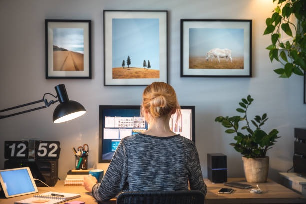 Brown study table with metal legs and dino lamp