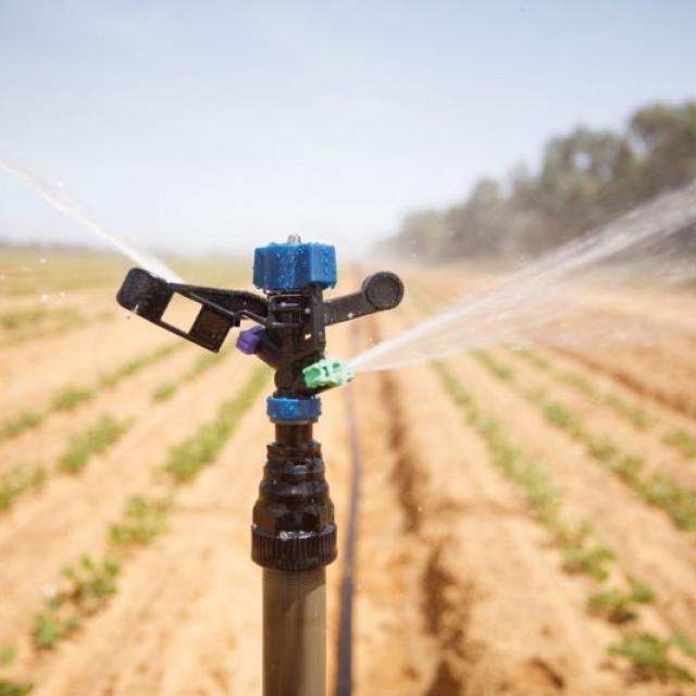 Using a tractor sprinkler to water your lawn is fun and innovative.