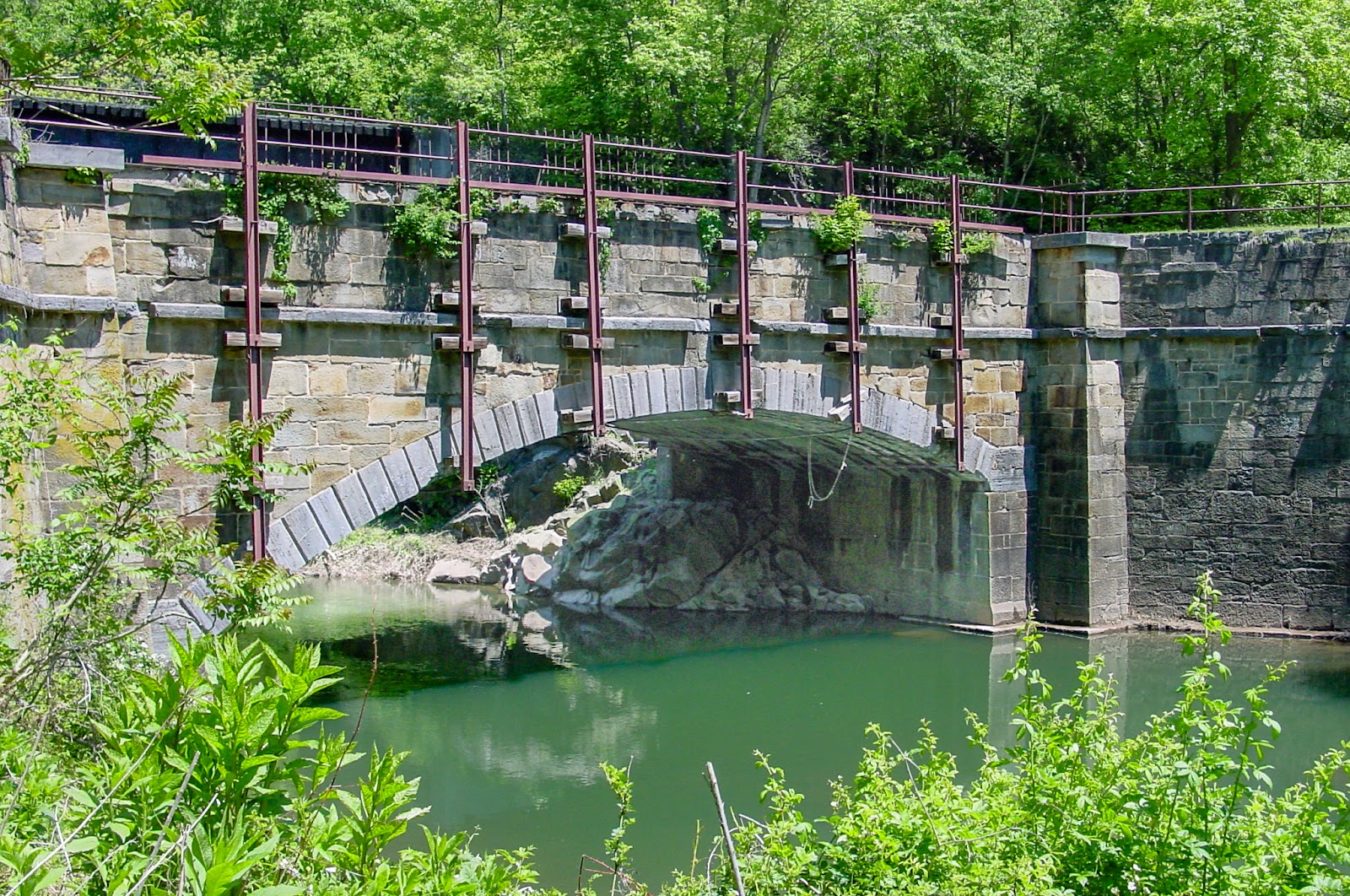 An aqueduct over a still creek. 
