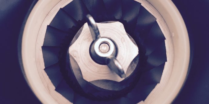 looking into the teeth of a conical burr grinder
