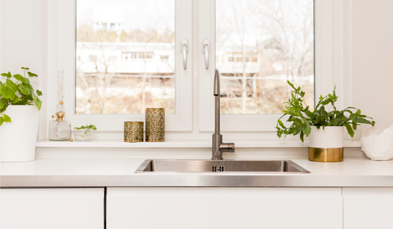 A kitchen sink with a good balance of the five feng shui elements: earth, metal, fire, water, and wood