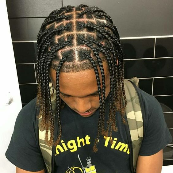 a black guy rocking braids 
