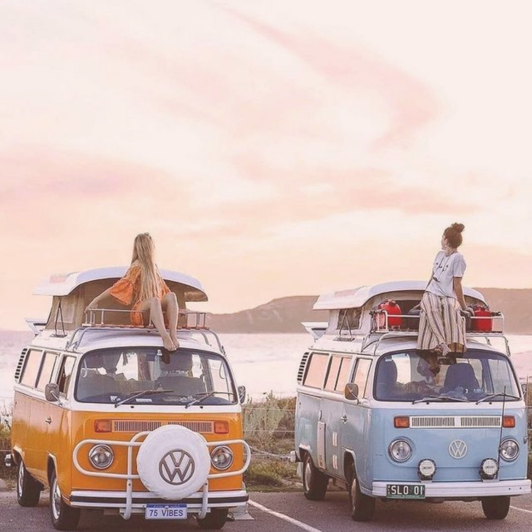  two campervans and two girls enjoying their holidays while capturing those memories by a professional photographer 