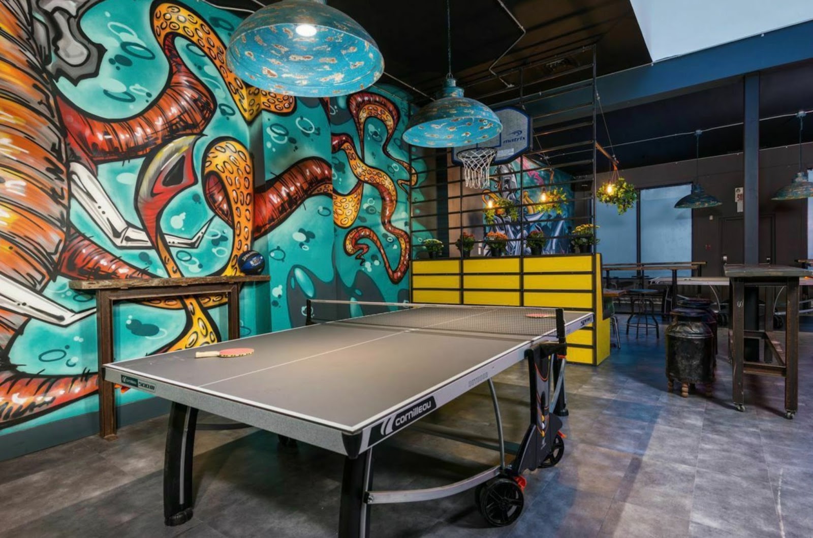 colorful graffiti style wall art in game room 