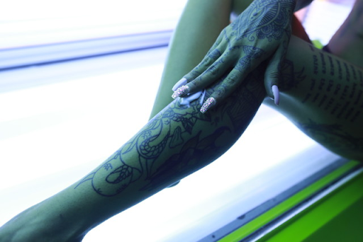 Do Tanning Beds Fade Tattoos? - How To Get Bronzed Without Fading Your Ink  - Tattify