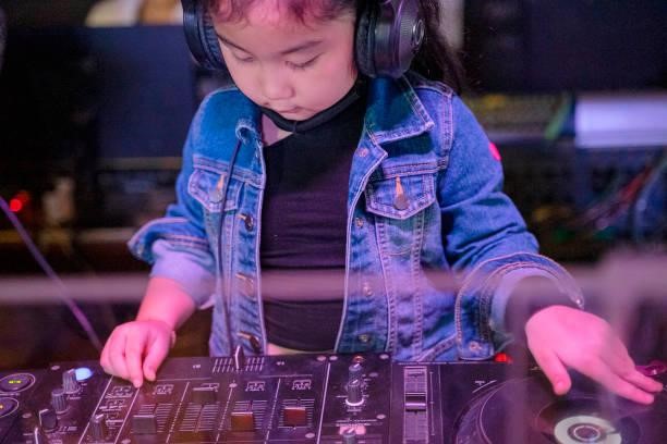 Little girl plays as DJ in concert. Little girl plays as DJ in concert. Leisure activity. kids party music stock pictures, royalty-free photos & images