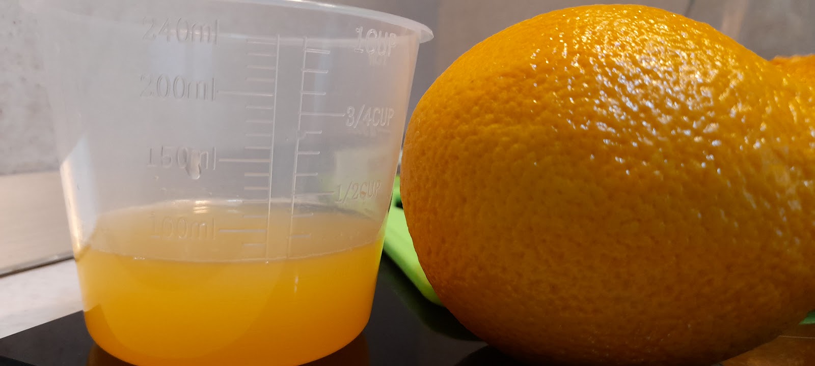 2.7oz/80ml of orange juice in a measuring jug.