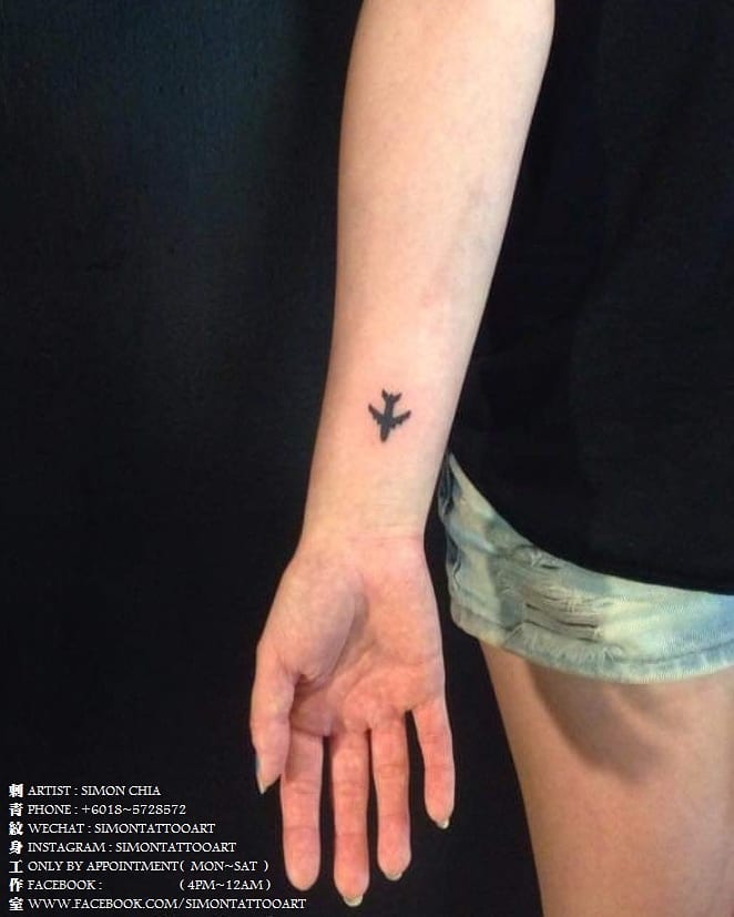 Small Plane Wrist Tattoo