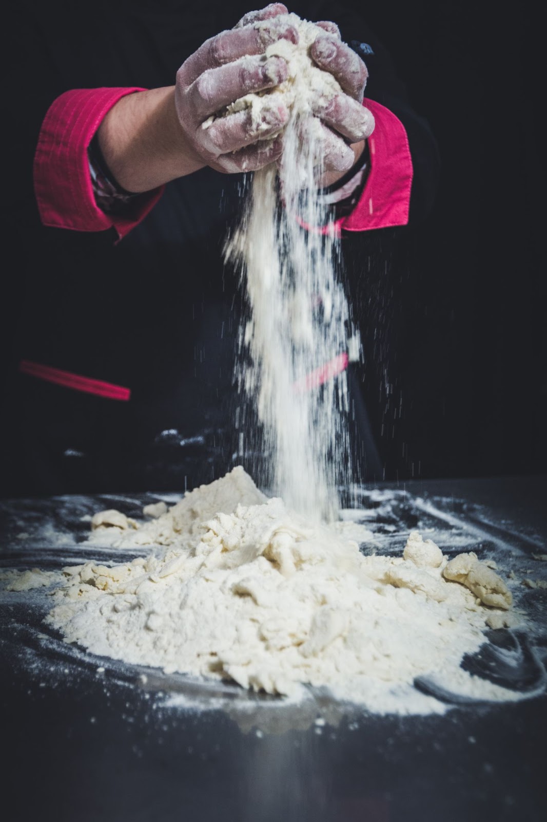 hands holding flour