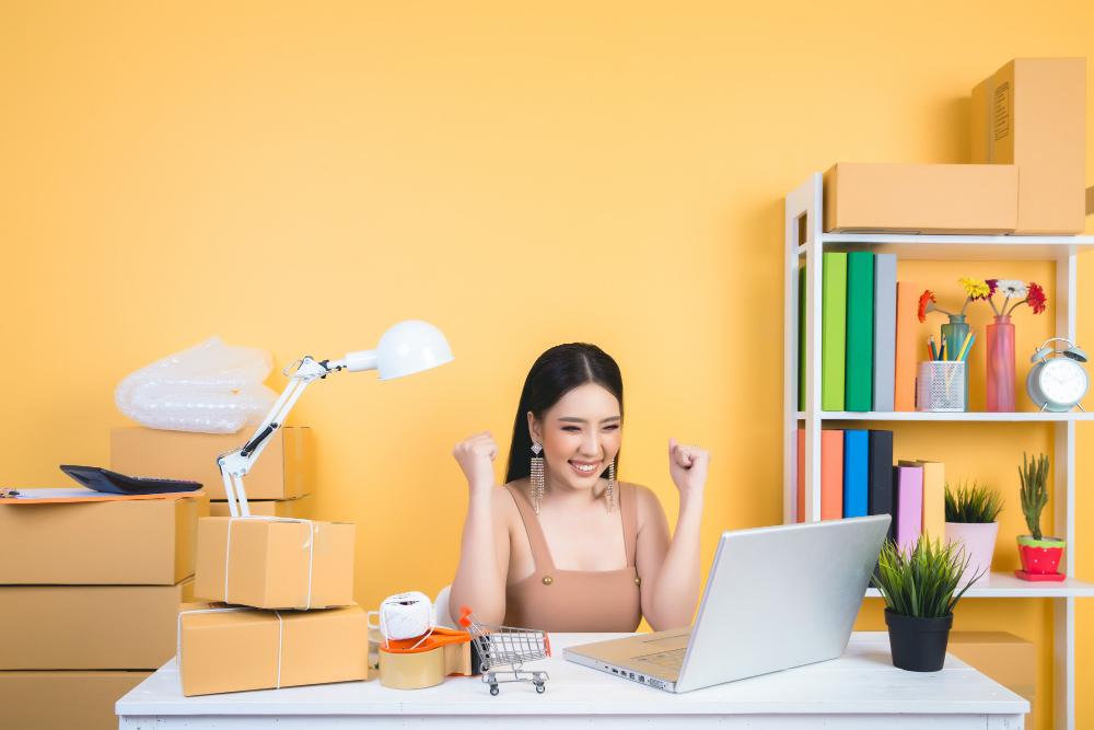 A person sitting at a table with a computer and a lamp

Description automatically generated with low confidence