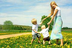 Mother and Children Playing Outside Stock Photography