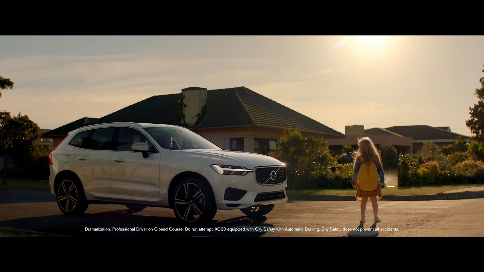 Volvo XC60 stops just before it's about to hit a little girl