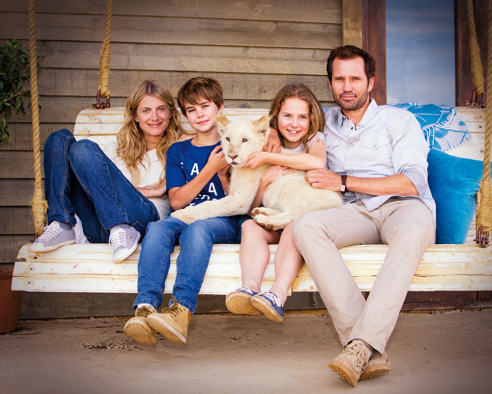 Still from Mia and the White Lion, starring Daniah De Villiers, Mélanie Laurent, Langley Kirkwood, and Ryan Mac Lennan.