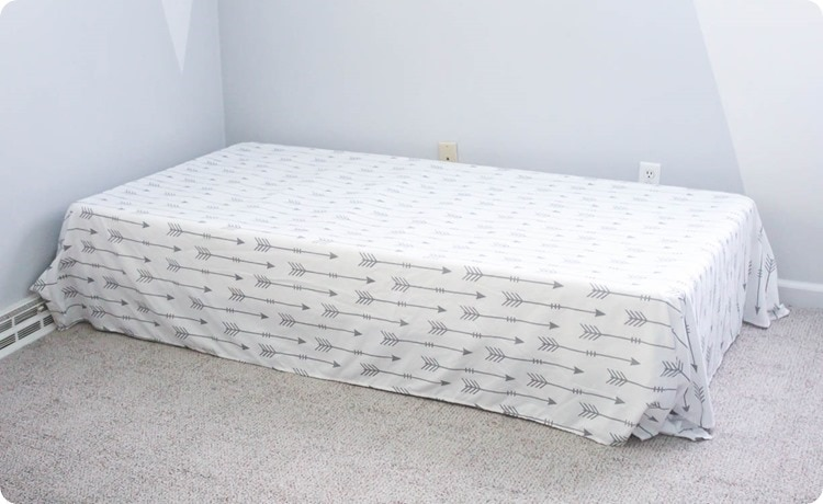 Fitted sheets can be draped over a box spring to hide it and the bed frame. 