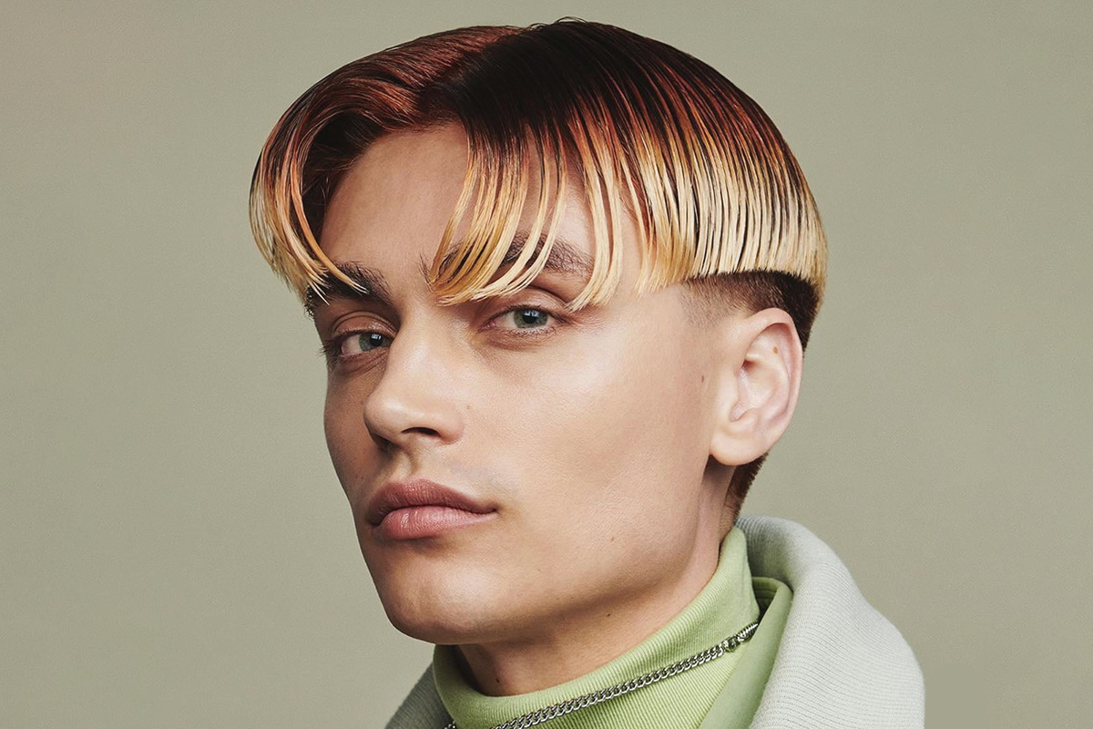Close up view of a guy rocking the blunt cut middle part