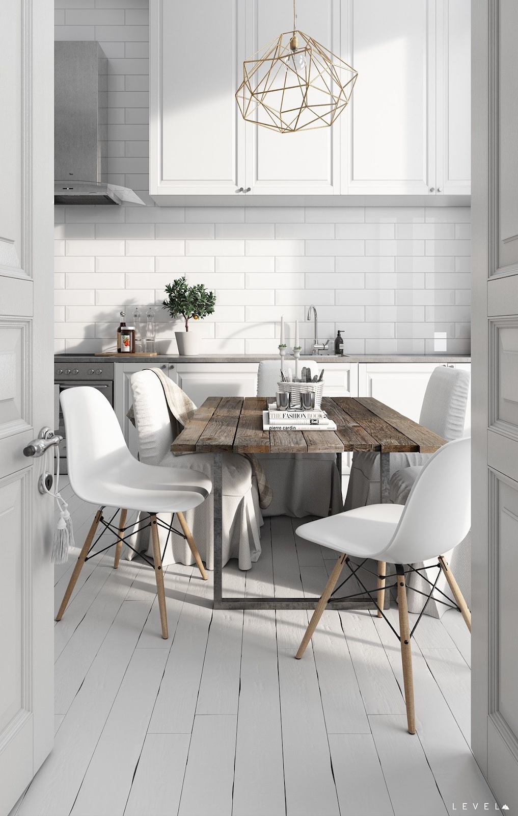 small white scandinavian kitchen with reclaimed wood table, white kitchen cabinets, white subway tile backsplash, white painted wood floors and stainless steel appliances