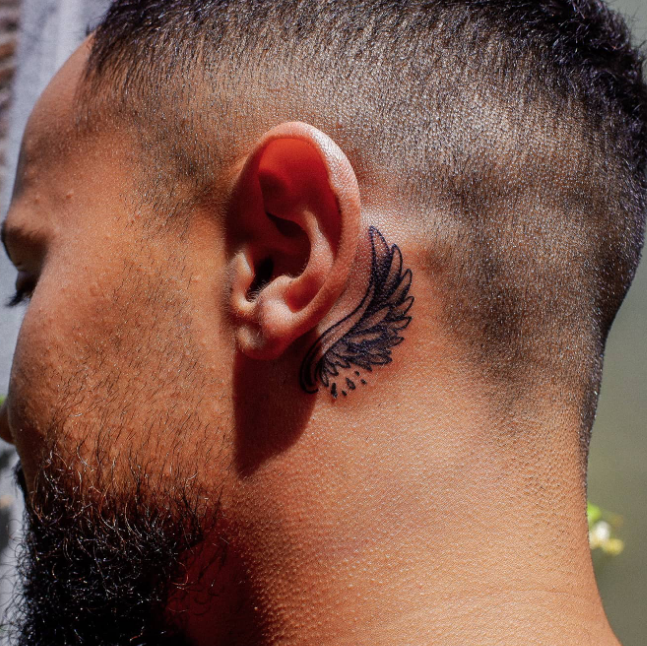 Behind the ear tattoo