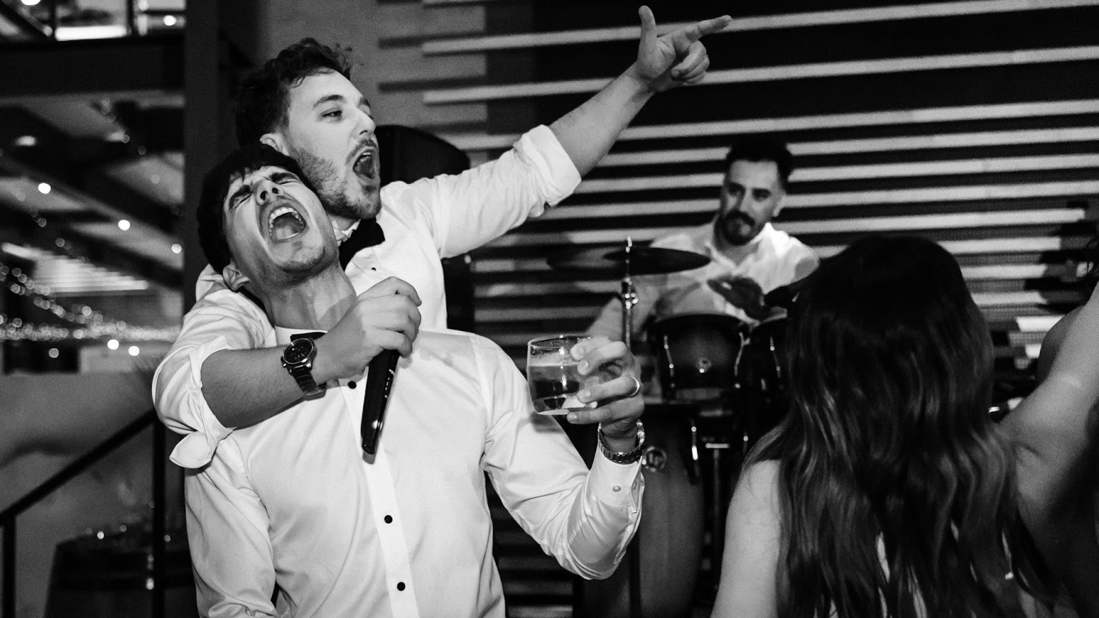 Groom and best man on the dance-floor captured with a documentary-style wedding photography at National Wine Center Adelaide