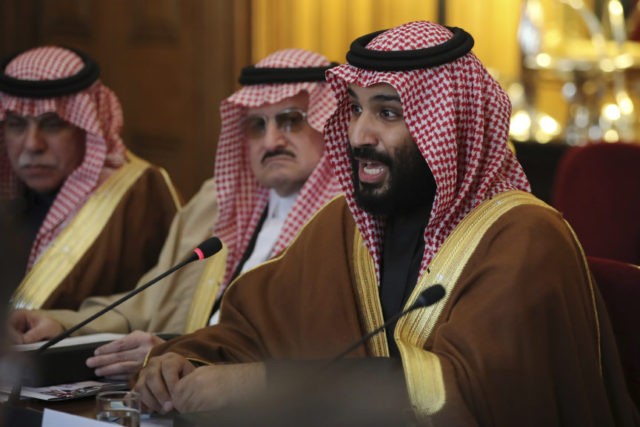 Saudi Crown Prince Mohammed bin Salman conducts a meeting with Britain's Prime Minister Theresa May with other members of their delegations, inside 10 Downing Street, London, on Wednesday March 7, 2018. Saudi Arabia's Crown Prince Mohammed bin Salman received a royal welcome with high level political talks to begin his three day visit to Britain, although protesters criticised the visit. (Dan Kitwood/Pool via AP)