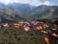 Local residents gather near their makeshift tents in Laprak village, Nepal's Gorkha district, on May 4, 2015