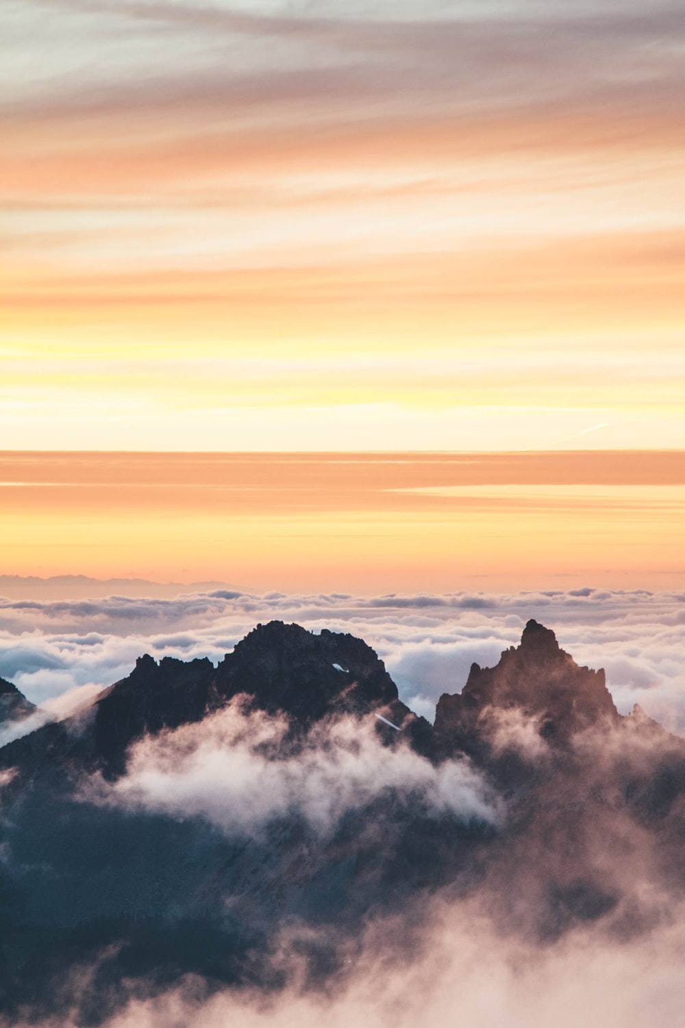 top view of mountain covered by clouds