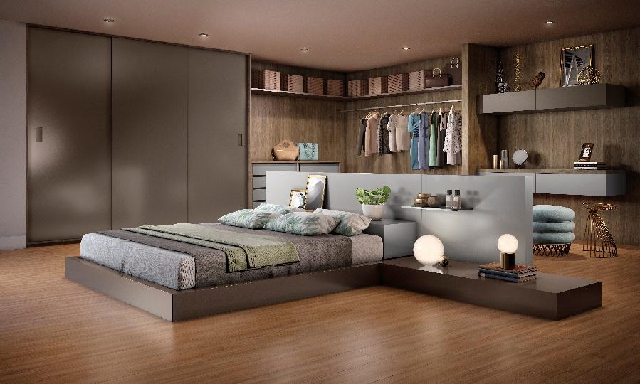 Quarto com piso de madeira, cama baia com cabeceira de MDF cinza, guarda roupa de madeira escura com closet e escrivaninha.