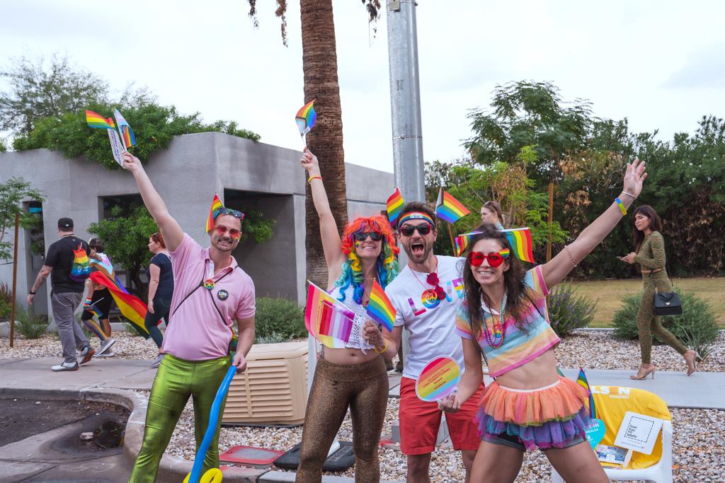 Group of Pride Festival attendees in brightly-colored attire